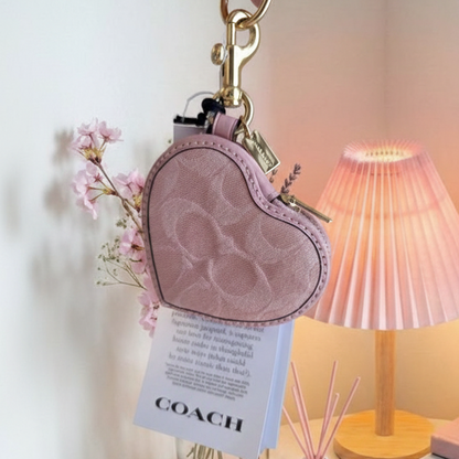 Coach Heart Charm - Front with lifestyle background