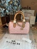 Coach Mini Rowan Bag In Signature With Charms in Powder Pink CEK79 NWT