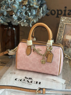 Coach Mini Rowan Bag In Signature With Charms in Powder Pink CEK79 NWT